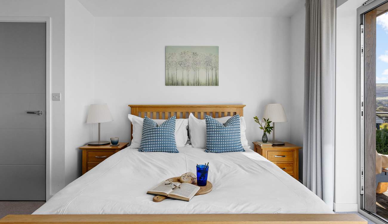 Both double bedrooms have king-size beds an en suite bathroom with a shared balcony.