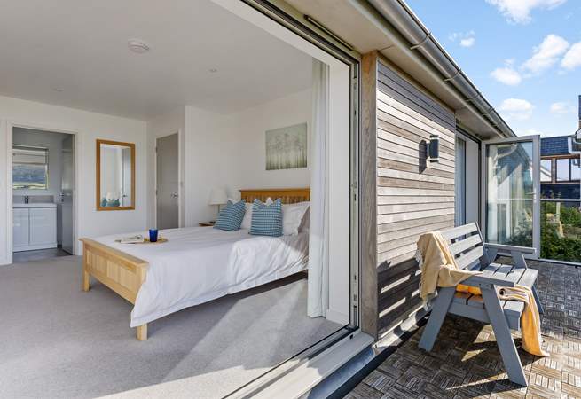 The balcony is shared by the two king bedrooms that sit to the front of the house with costal views.