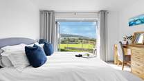 The picture window with views towards the beach and sand dunes.