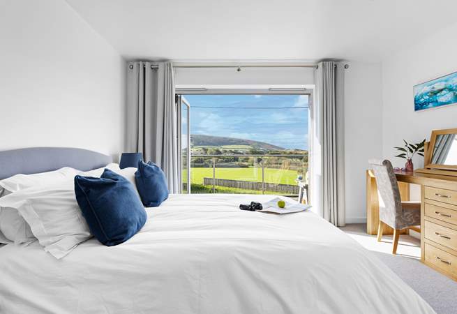 With views out to the beach and sand dunes you have the perfect spot to take in the ever changing picture window.