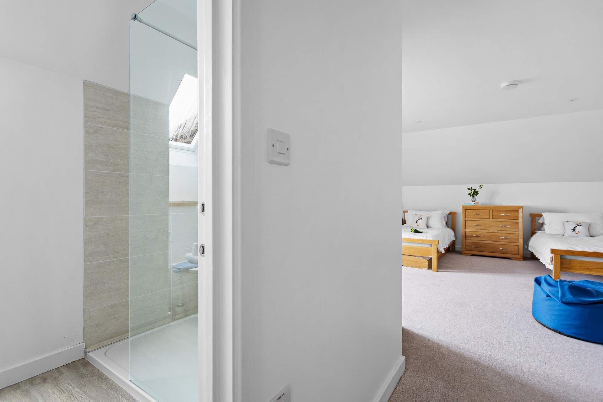 The en suite shower room is also spacious and bright.