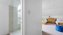 The en suite shower room is also spacious and bright.