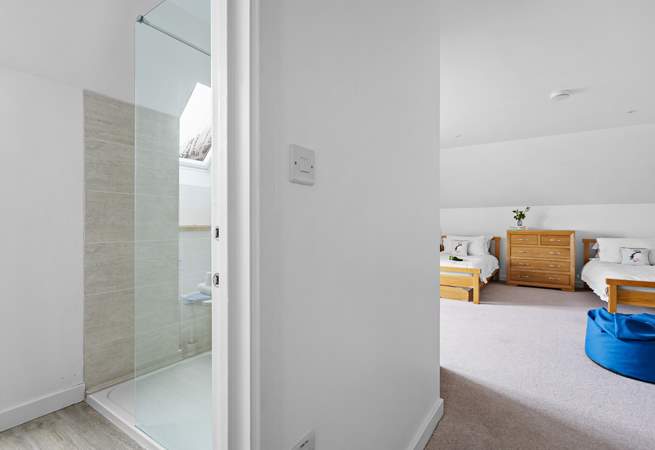 The en suite shower room is also spacious and bright.