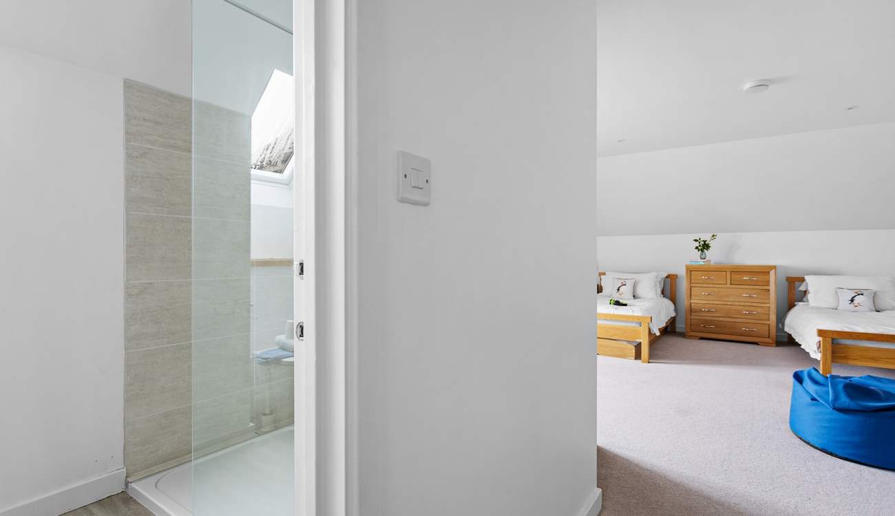 The en suite shower room is also spacious and bright.
