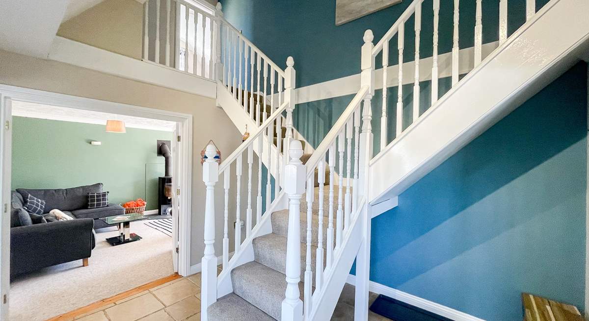 Climb the stairs to the bedrooms on the first floor. 