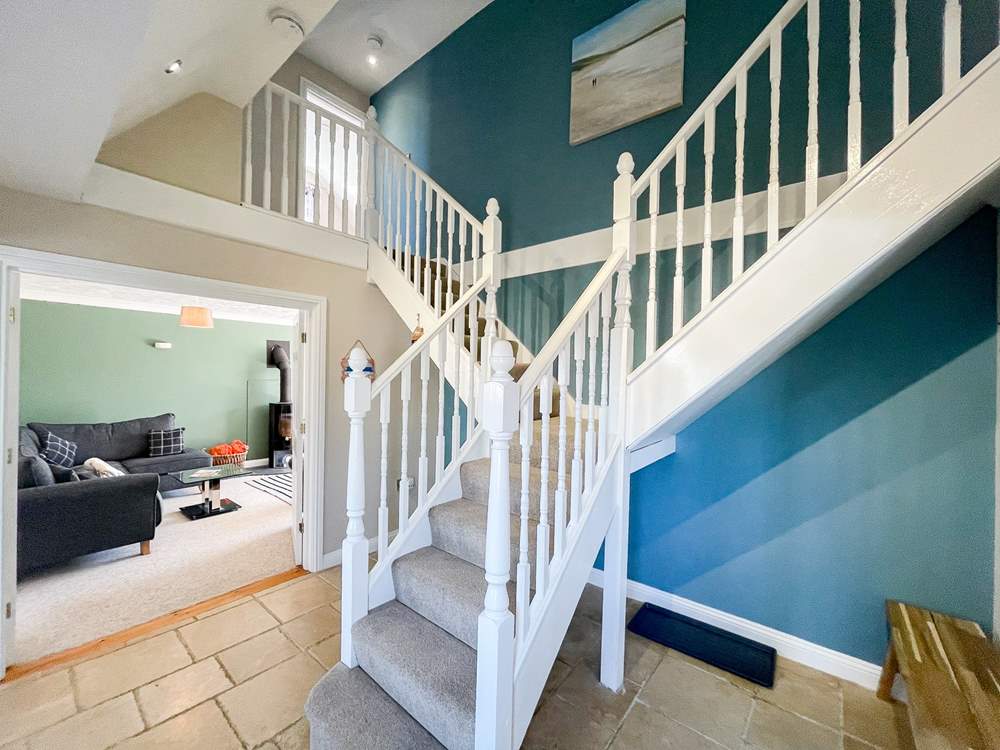 Climb the stairs to the bedrooms on the first floor.