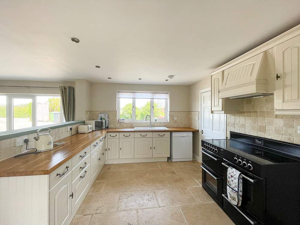 Oodles of space and an impressive four oven range in the kitchen/breakfast-room.
