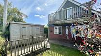 The garden is enclosed, ideal for dogs and children alike. 