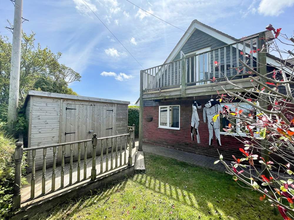 The garden is enclosed, ideal for dogs and children alike.