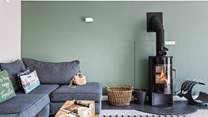 Relax on the cosy corner sofa after a busy beach day. 
