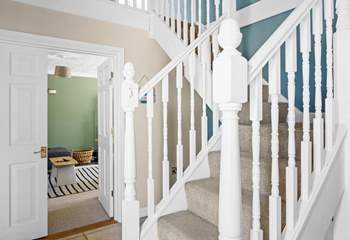 Climb the stairs to the bedrooms on the first floor. 