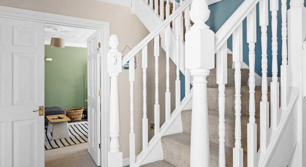 Climb the stairs to the bedrooms on the first floor. 