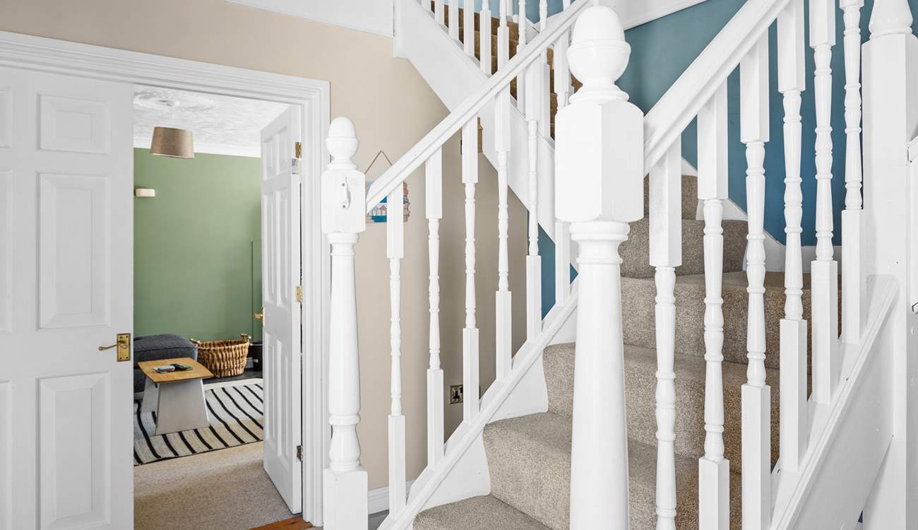 Climb the stairs to the bedrooms on the first floor. 