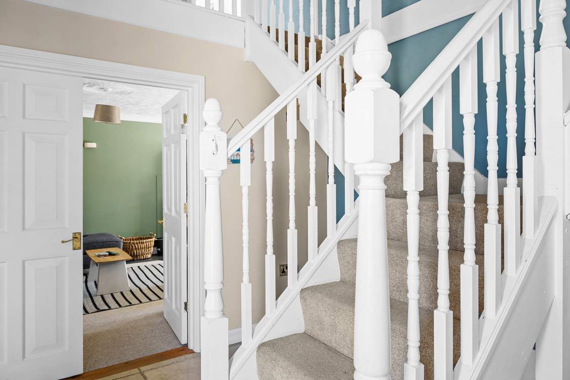 Climb the stairs to the bedrooms on the first floor.