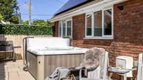 The hot tub is perfect for relaxing after a day on the beach. 