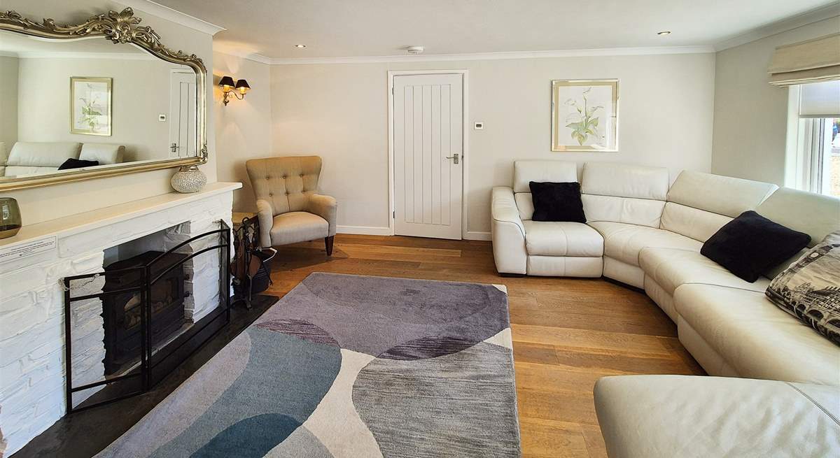 Unwind after a day by the sea in the spacious living-room.