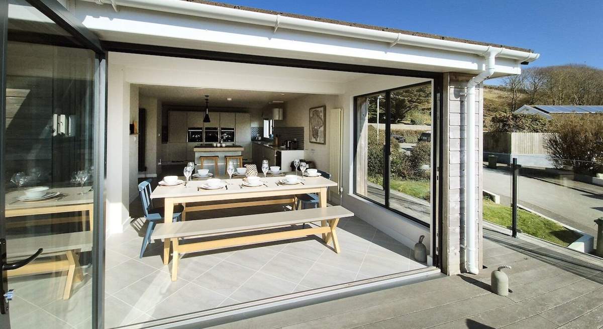Fold back the bi-fold doors and let the fresh air in. 
