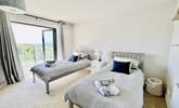 The twin bedroom has access to the balcony. - Thumbnail Image