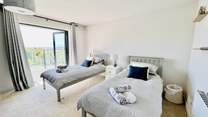 The twin bedroom has access to the balcony.