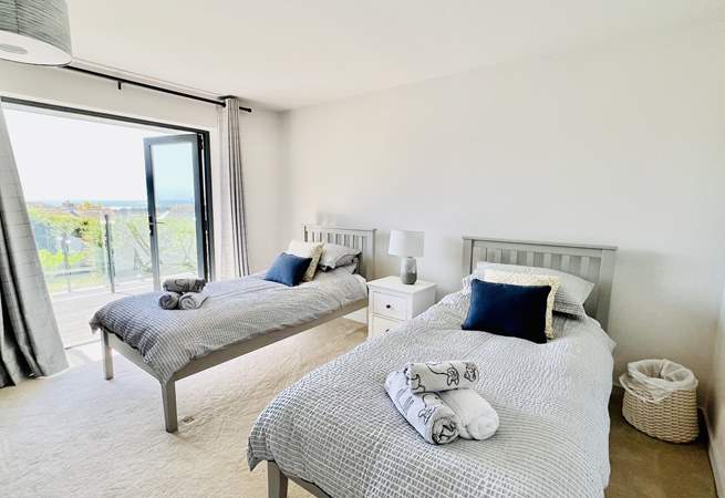 The twin bedroom has access to the balcony.