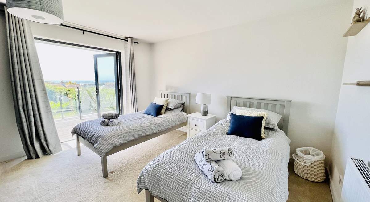 The twin bedroom has access to the balcony.