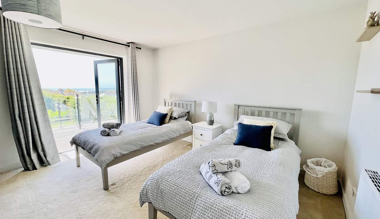 The twin bedroom has access to the balcony.