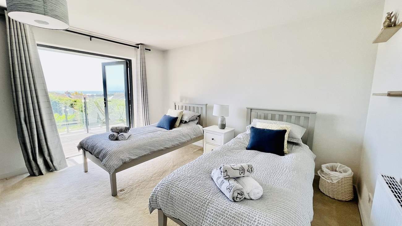 The twin bedroom has access to the balcony.