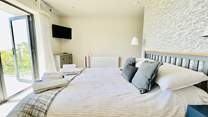 This sumptuous room has a king-size bed and access to the balcony. 