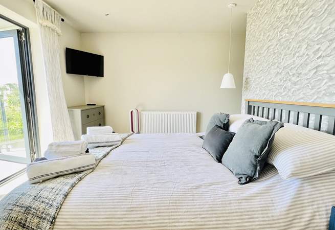 This sumptuous room has a king-size bed and access to the balcony. 