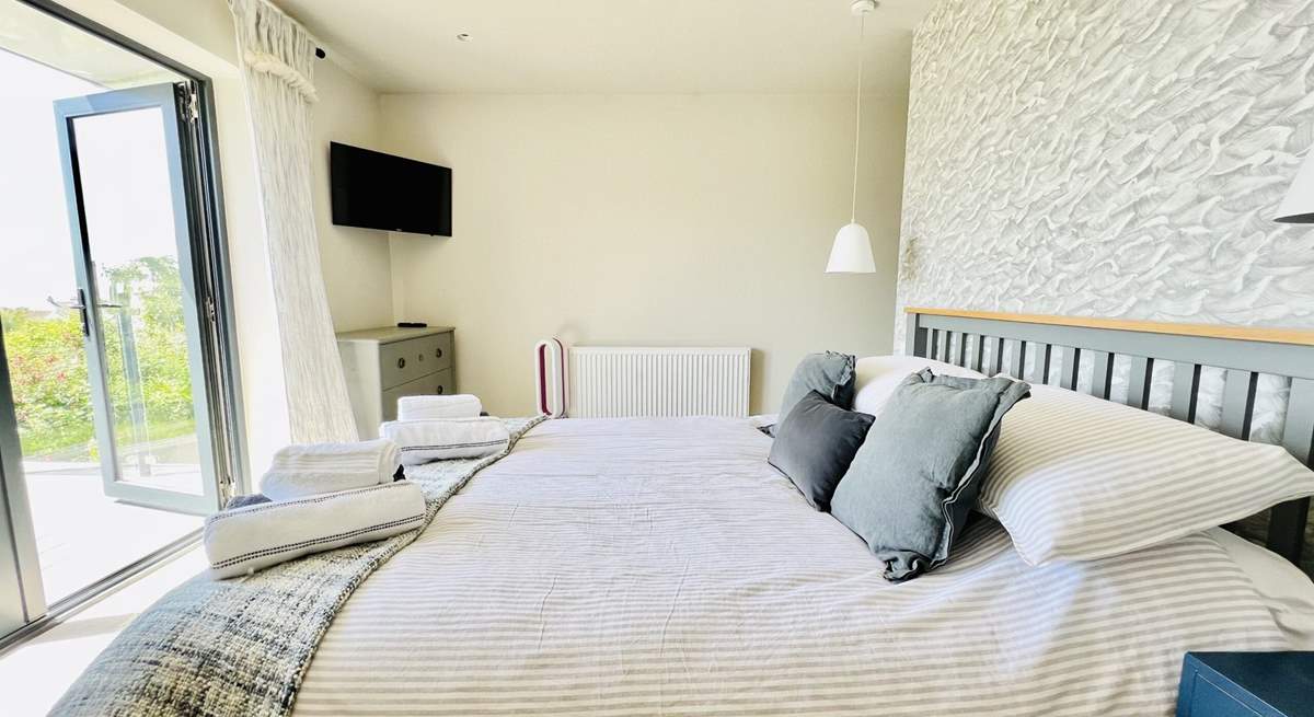 This sumptuous room has a king-size bed and access to the balcony. 
