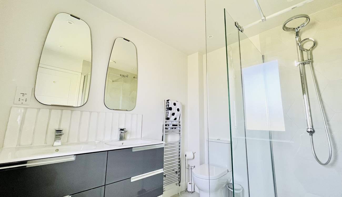 The family bathroom on the first floor has a free-standing bath and separate shower cubicle. 