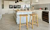Perch on a stool as dinner is prepared.  - Thumbnail Image