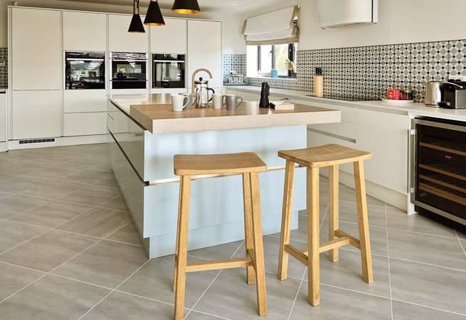 Perch on a stool as dinner is prepared. 