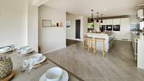 This contemporary space is fabulous for sociable dining on holiday. 