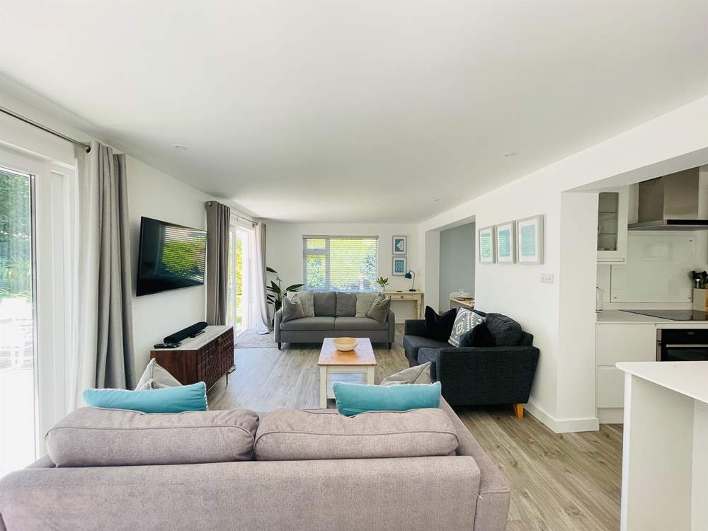 The open plan living area - a great spot to relax after a day by the sea.