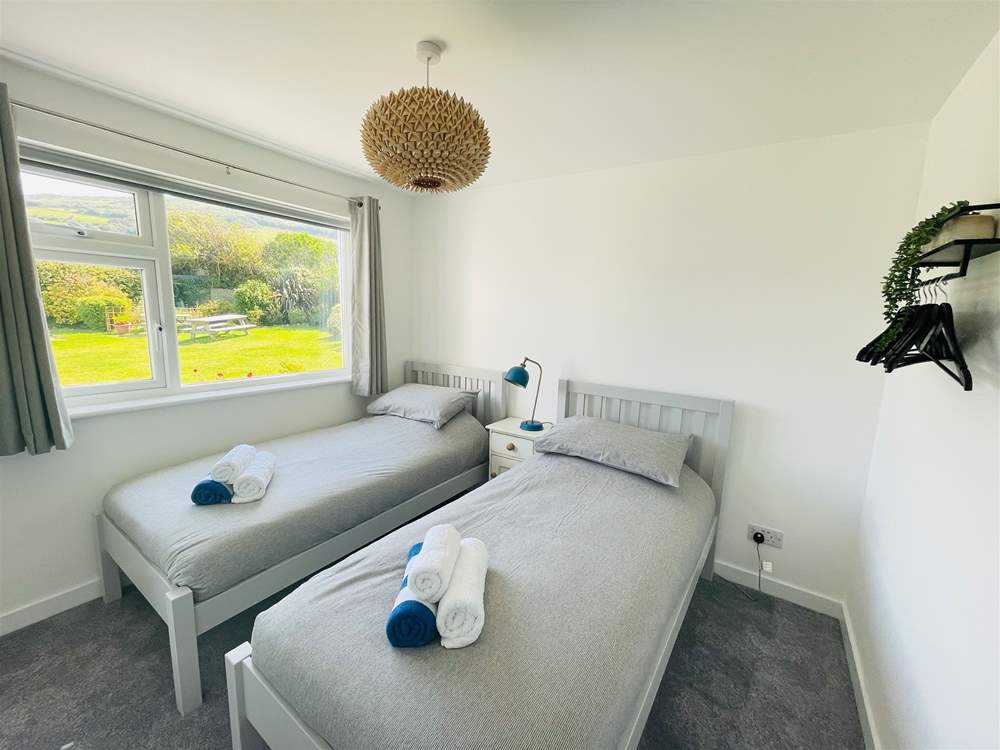 This ground floor twin room has beautiful garden views.
