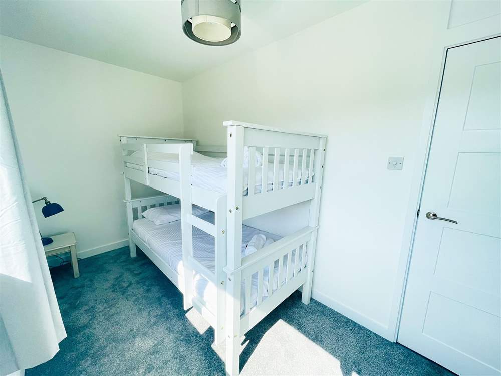Bedroom five has bunk beds.
