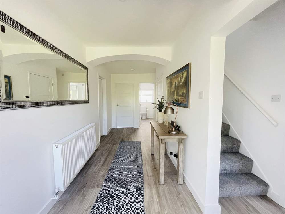 Head upstairs to find three more bedrooms.