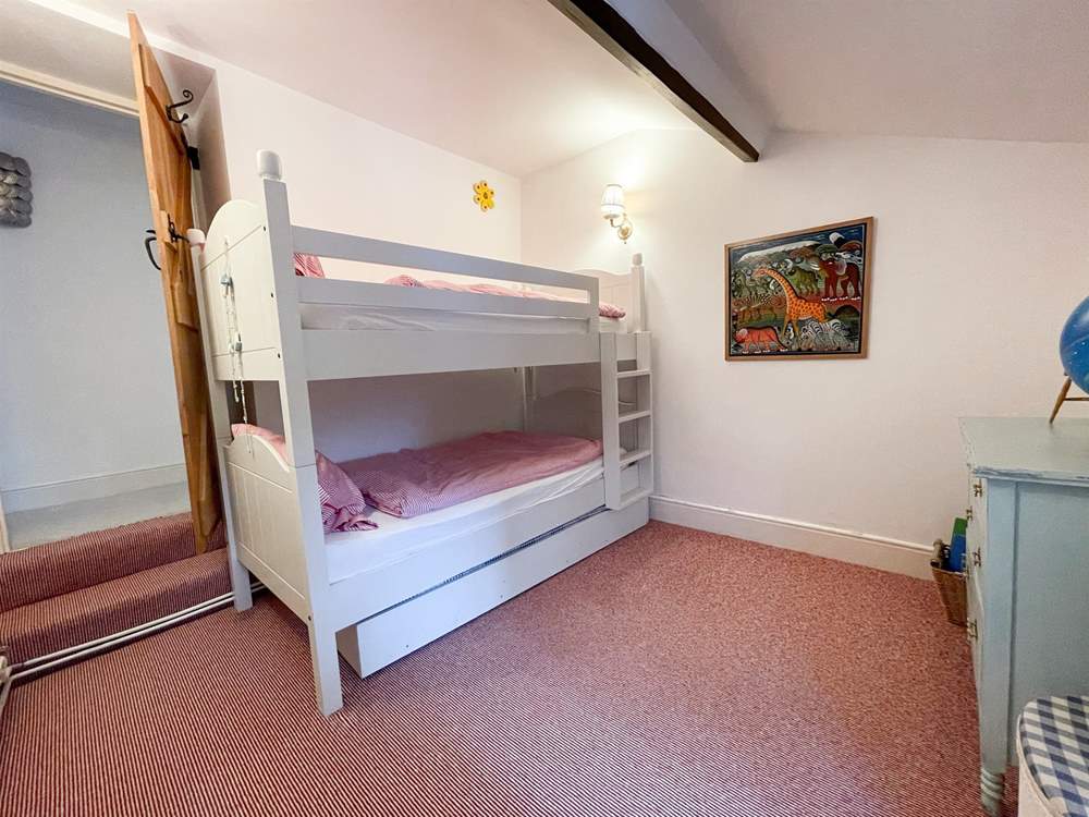 The children will love the bunk-beds in this room.