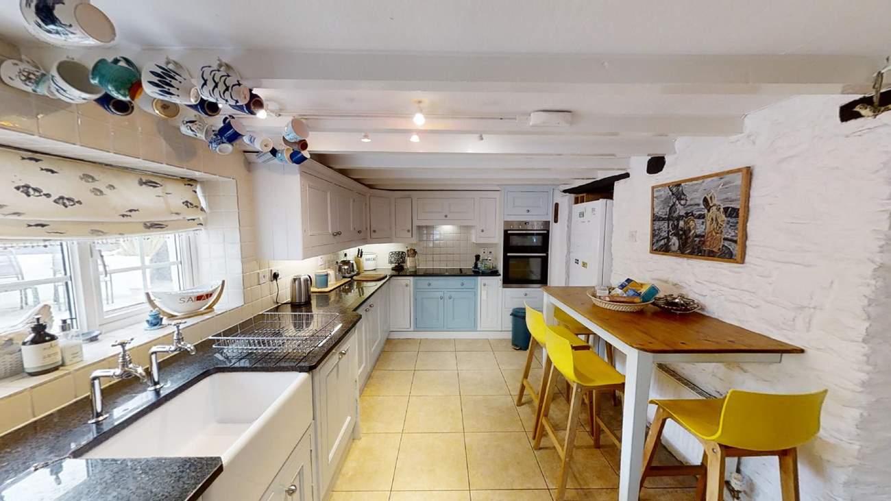 The kitchen has a handy breakfast bar.