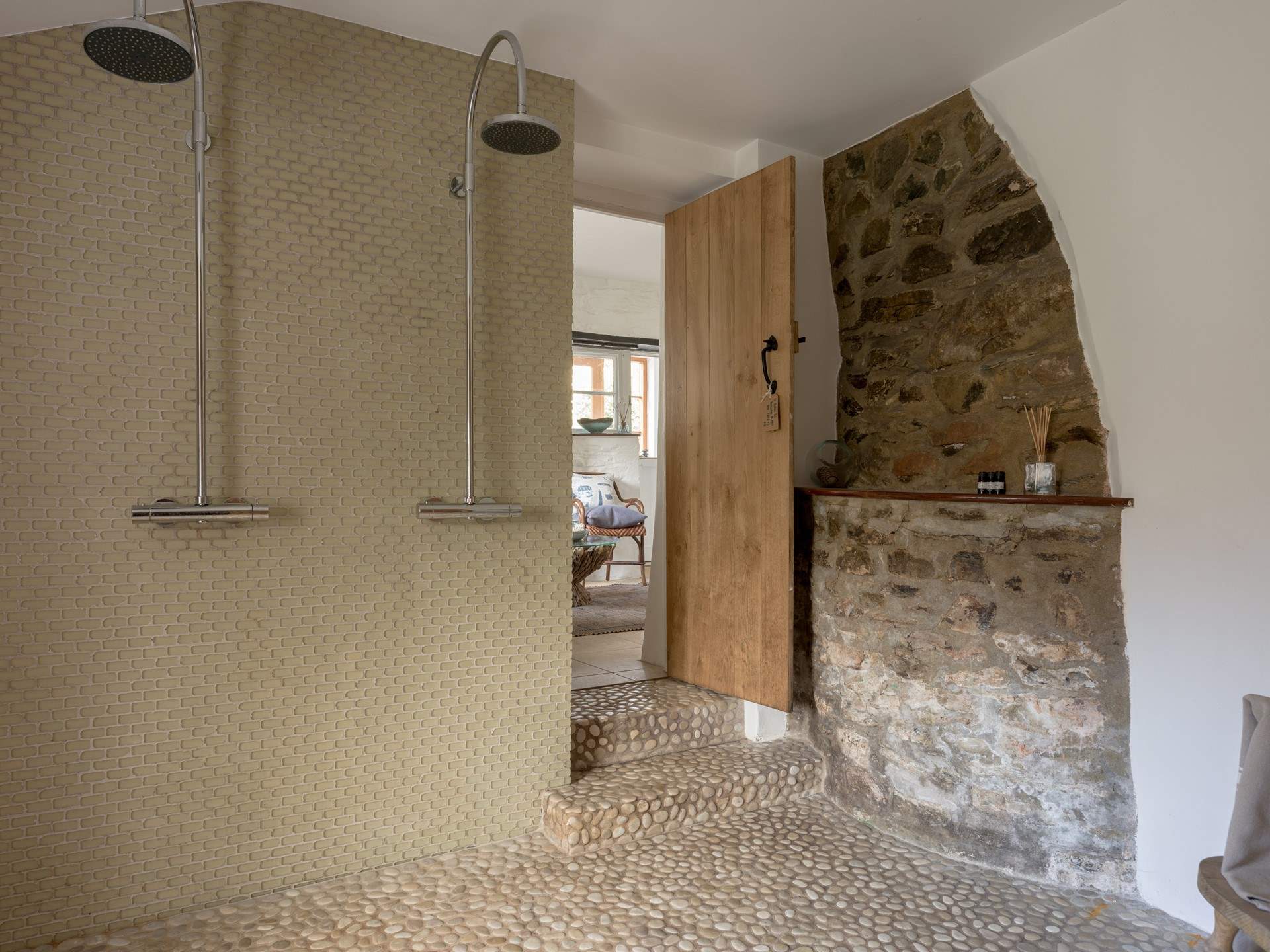 Walk through to the sauna room with double showers and the luxury of a sauna.