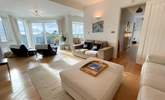 Relax on the sofas and watch a movie on the Smart TV. - Thumbnail Image