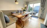 The dining area has sliding doors onto the patio. - Thumbnail Image