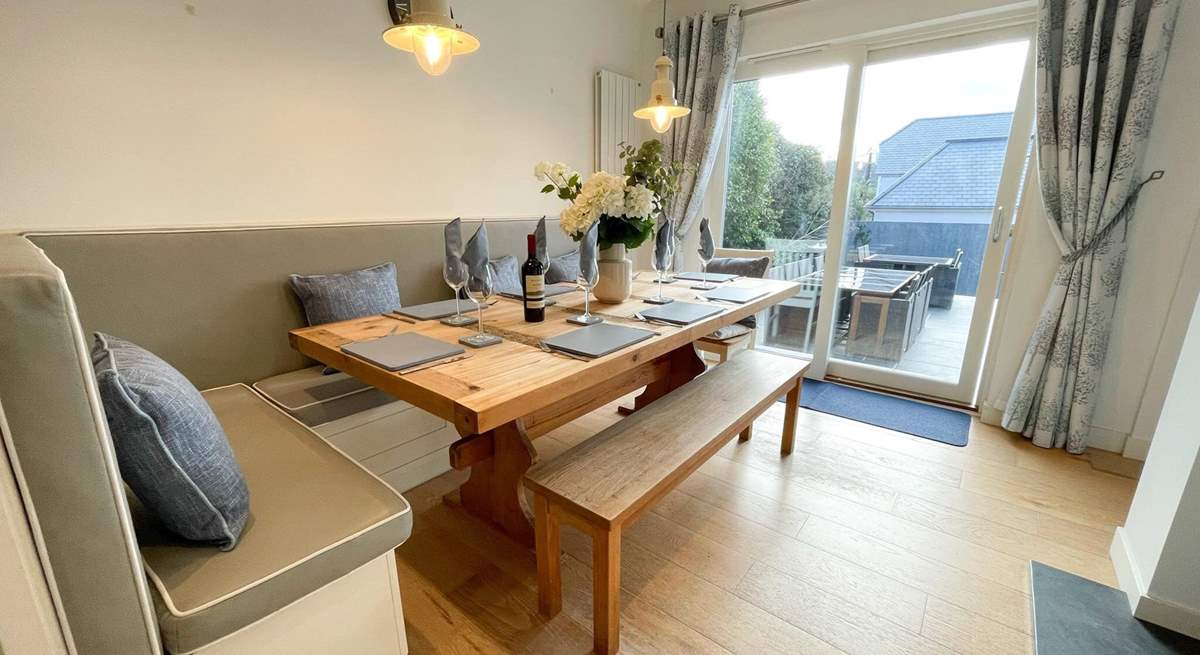The dining area has sliding doors onto the patio.