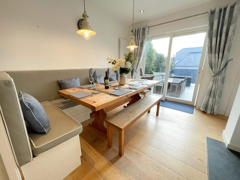 The dining area has sliding doors onto the patio.