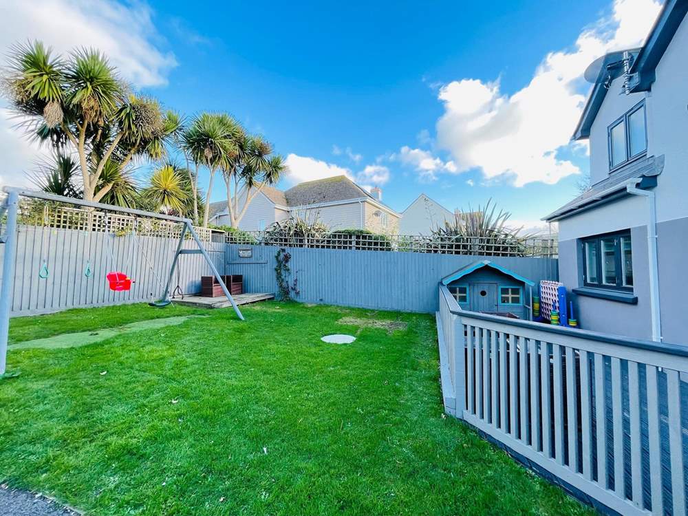 Plenty of space on the lawn for the children and family dog.
