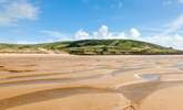 Families will enjoy the miles of golden sand here.  - Thumbnail Image