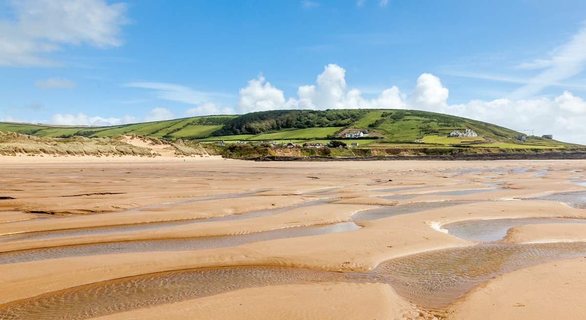 Families will enjoy the miles of golden sand here. 
