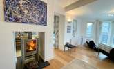 The fire warms both the sitting and dining areas.  - Thumbnail Image