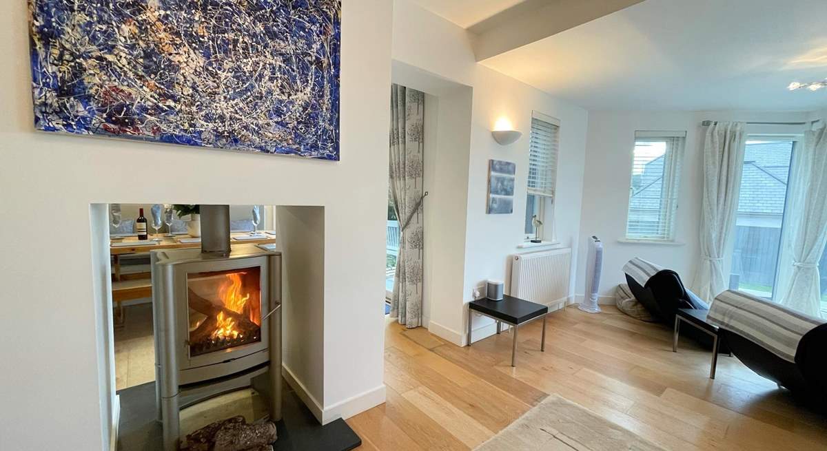The fire warms both the sitting and dining areas. 